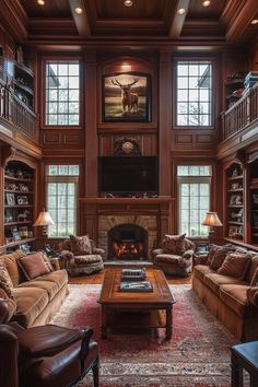 a living room filled with lots of furniture and a fire place in the middle of it