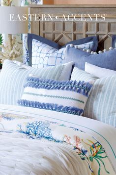 Tropical dreams come to life in this joyfully colored bedding collection. Its cheerful coral reef print sits proudly alongside seersucker striped standard shams, a layered loop and tassel trim bolster, and unique hand painted decorative pillows. Layered in your coastal getaway or summery guestroom, Castaway exudes seaside views with a hint of preppy poise. Preppy Coastal Bedroom, Seaside Interiors, Colored Bedding, Pillow Trim, Coral Reef Print, Coastal Mirrors, Beach House Interior Design, Modern Mediterranean, Bedroom Ambiance