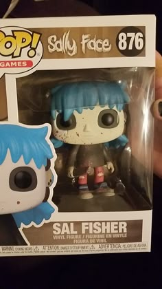 someone holding up a funky pop vinyl figure from the game scary face 786 seal fisher