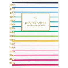 a spiral bound planner with colorful stripes