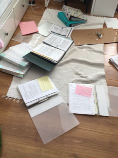 many papers are spread out on the floor