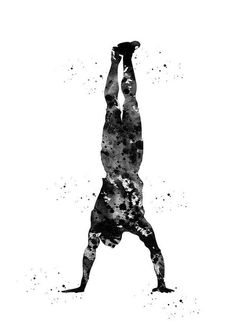 a black and white photo of a person doing a handstand in the air