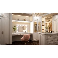 a room with white cabinets and a chandelier