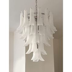 a white chandelier hanging from the ceiling