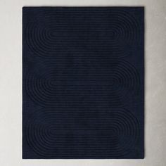 a black rug with wavy lines on it