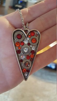 Fire Bullet Heart NecklaceHandmade itemMaterials: nickle plated brass, nickle plated bullet, swarovski crystal