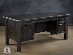 a desk made out of metal with two drawers on the top and one drawer at the bottom