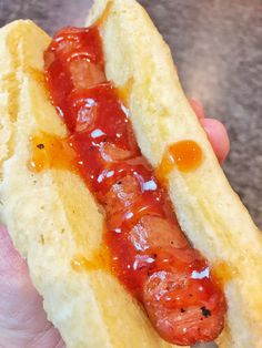 a hot dog with ketchup and mustard on it