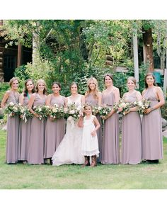 a group of women standing next to each other