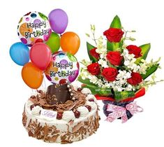 a birthday cake with balloons and flowers next to it