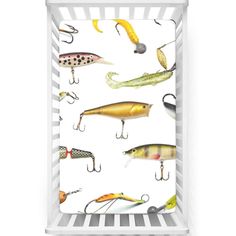 a baby crib with different types of fishing lures and hooks on the sides