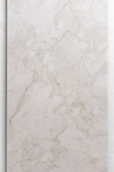 a white marble textured wall with no one in it