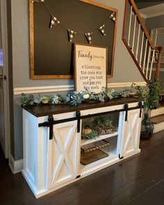 the entryway is decorated with greenery and decorations