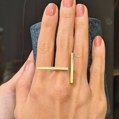 This unique, stylish Brass Double Bar Minimalist Ring will always be the center of attraction. This Open Gold Bar Ring is made of brass. This brass adjustable two bars ring is hammered, textured and polished totaly by hand carefully in our studio. Every piece in our studio is handmade which makes them unique. You will have very similar looking ring but not identical. The ring is adjustable so you can use it on your different fingers. Even so, please select your size via the drop-down menu so tha Long Bar Ring, Gold And Silver Jewelry Together Modern, Adjustable Unique Rings, Luxury Minimalist Bands For Formal Occasions, Cheap Unique Open Midi Rings, Cheap Minimalist Metal Ring Jewelry, Luxury Minimalist Ring In Recycled Gold, Elegant Metal Midi Rings, Luxury Minimalist Rings As A Gift