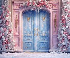 a pink and blue door decorated with ornaments