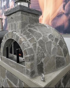 an outdoor pizza oven made out of stone