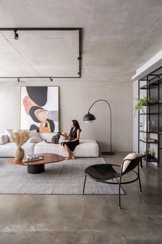 a woman sitting on a couch in a living room