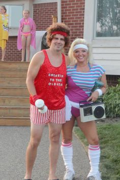 two people dressed up in costumes standing next to each other