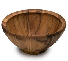 a wooden bowl sitting on top of a white table