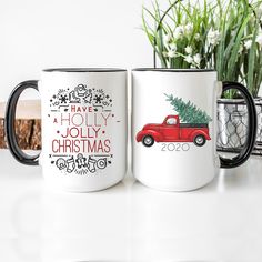 two coffee mugs with christmas designs on them