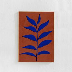 an orange and blue painting on a wall with a plant in the middle, against a white background