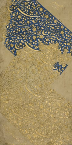 an intricately designed blue and gold painting on the ground with trees in the background