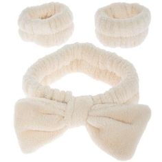 Band Thickness: 2" Size: One Size Fits Most Color: Cream Material: Fabric Care & Safety: Machine Washable UPC: 810137680019 Quantity: 1 Headband & 2 Wristbands Freshen your skincare routine with our Spa Headband & Wristbands. This soft elastic headband protects your hair while featuring a cute bow on the front to make your bathroom routine comfy and stylish. Additionally, it includes a set of matching wristbands to keep your arms and elbows dry. Say goodbye to stress and hello to relaxation with Skincare Headband And Wrist, Cute Spa Headband, Spa Headbands, Plush Spa Headband, Palm Springs Pool Party, Bathroom Routine, Spa Headband, Elastic Headband, Cute Bow