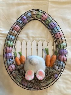 an easter wreath with bunny ears and carrots