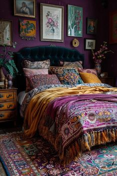 a bed sitting in a bedroom next to a purple wall with pictures on the walls