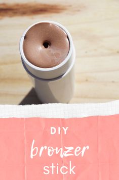 a coffee cup sitting on top of a piece of paper with the words diy bronzer stick