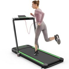 a woman is running on a treadmill with an electronic device attached to the side