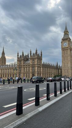 the big ben clock tower towering over the city of london on a partly cloudy day