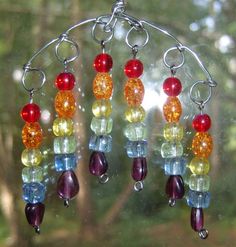 a close up of a wind chime hanging from a window