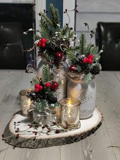 christmas decorations in mason jars on a wooden tray