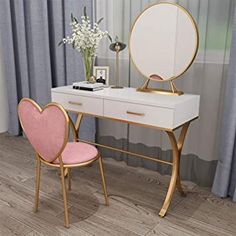 a desk with a mirror, chair and vase on it in front of a window