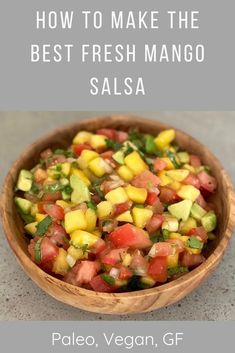 a wooden bowl filled with fresh mango salsa on top of a gray counter next to the words how to make the best fresh mango salsa