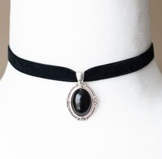 This Victorian inspired choker is made from black velvet ribbon and antique silver filigree pendant housing a black agate stone. - The choker measures 12 inches/30.5cm in length and 0.4 inches/10mm wide - The pendant is approximately 1 inch long and 0.75 inch wide - The choker closes with a lobster claw clasp at the back - One size fits most (for a neck of about 12.5 inches). there is a 2 inch extension chain at the back to accommodate larger neck sizes SHIPPING: Default shipping is by regular m Formal Black Ribbon Choker Jewelry, Formal Black Jewelry With Black Ribbon, Black Velvet Ribbon, Black Agate Stone, Gothic Chokers, Black Velvet Choker, Black Choker Necklace, Vintage Inspired Jewelry, Velvet Choker