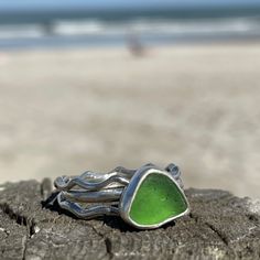 This beautiful piece of Sea Green Sea Glass was found in Hawaii. 925 Sterling silver and fine silver was use to create this handmade ring. The stacking bands are half round sterling silver, one is hammered. The main ring band is formed from half round sterling silver wire into a wavy band. This collection includes three separate rings. Size 10 Photos are taken outside in sunlight and shaded areas to show the way the light shines differently on the sea glass and pottery. Seaglass Rings, Funky Jewellery, Silver Smithing, Sea Glass Ring, Sea Glass Crafts, Stacking Bands, Green Sea, Funky Jewelry, Jewelry Show