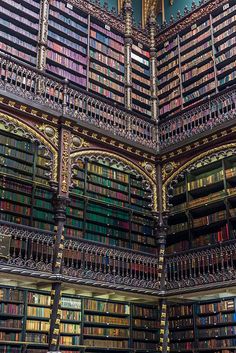 the interior of a library with many bookshelves filled with lots of different colored books