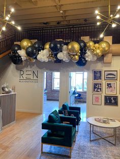 an open lobby with balloons and couches