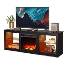 a flat screen tv sitting on top of a black entertainment center next to a fire place