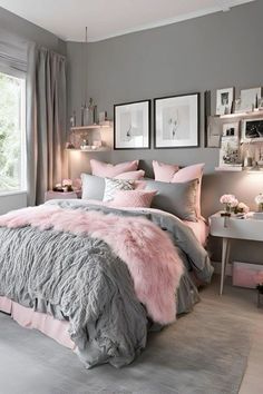 a bedroom with grey walls and pink bedding