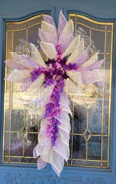 This beautiful Easter/Mother's Day Cross is made of lavender and white Poly Burlap Mesh on a wire frame with artificial flower accents. It can be used as either a wall hanging, door wreath, or Easter Grave Marker for your lived one. Hanging Door, Grave Marker, Wire Frame, Door Wreath, Door Wreaths, Cemetery, Artificial Flowers, Burlap, Mother's Day