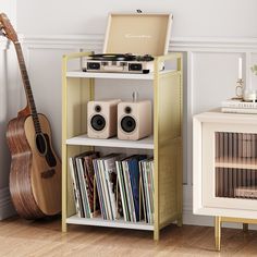 a record player and other musical equipment are on a shelf next to a small cabinet