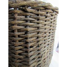 a large basket made out of wood sticks