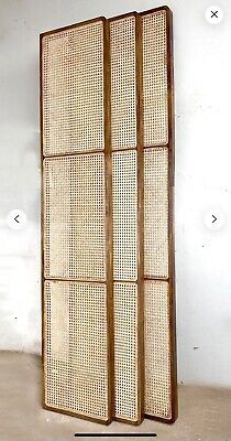 a room divider made out of rattan with four panels on each side and one panel