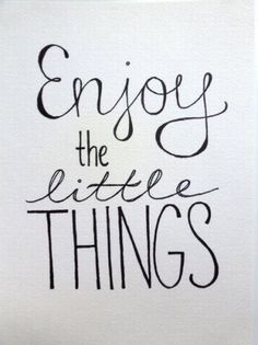 the words enjoy the little things written in black ink on white paper, with an image of