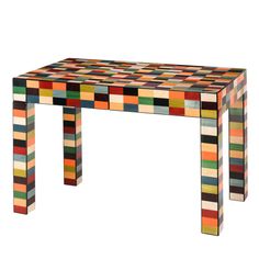 a multicolored wooden table sitting on top of a white floor