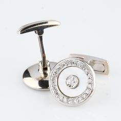 One pair electronically tested 14KT white gold gents cast & assembled cufflinks. Condition is very good. Each features a bezel set diamond solitaire set within an inner, inlay mother-of-pearl like bezel and an outer diamond bezel. Bright polish finish with milgrain detailing. Cufflinks are 16.5 mm in diameter. Identified with markings of "14K". Containing: Two bezel set round brilliant cut diamonds Measure 3.00 - 3.00 x 1.80 mm (depth est.) Approximate total weight of 2 stones = 0.20 ct. Graded in the setting. Clarity: SI-1 Color: H Forty-four bead set round brilliant cut diamonds Measure 1.50 - 1.40 x 0.87 mm (depth est.) Approximate total weight of 44 stones = 0.50 ct. The below listed clarity & color grade reflect an overall average for the group. Graded in the setting Clarity: SI-1 Col Diamond Cufflinks Men, Diamond Cufflink, Round Solitaire, Solitaire Setting, Bezel Set Diamond, Cufflinks Men, Bezel Diamond, Tie And Pocket Square, Tie Accessories