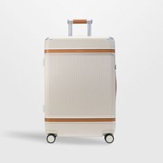 Take to the skies like a pro with the sleek Aviator suitcase from Paravel. Clad in durable cream polycarbonate with aluminum and tan vegan leather accents, the hard-shell case boasts a handsome ridged texture that hides scuffs. Double-spinner wheels with carbon steel bearings rotate 360 degrees for the smoothest roll. Ideal for extended stays and far-flung journeys, the hard-side checked bag accommodates up to 10 days' worth of clothes plus 4 pairs of shoes. The TSA-approved lock keeps your poss Classic Brown Formal Luggage, Cream Luggage, Luxury Beige Leather Luggage, Luxury White Rectangular Luggage, Modern Hard Shell Luggage For Travel, Brown Leather-backed Rectangular Luggage, Leather Suitcase, Gravy Boat, Warm Water